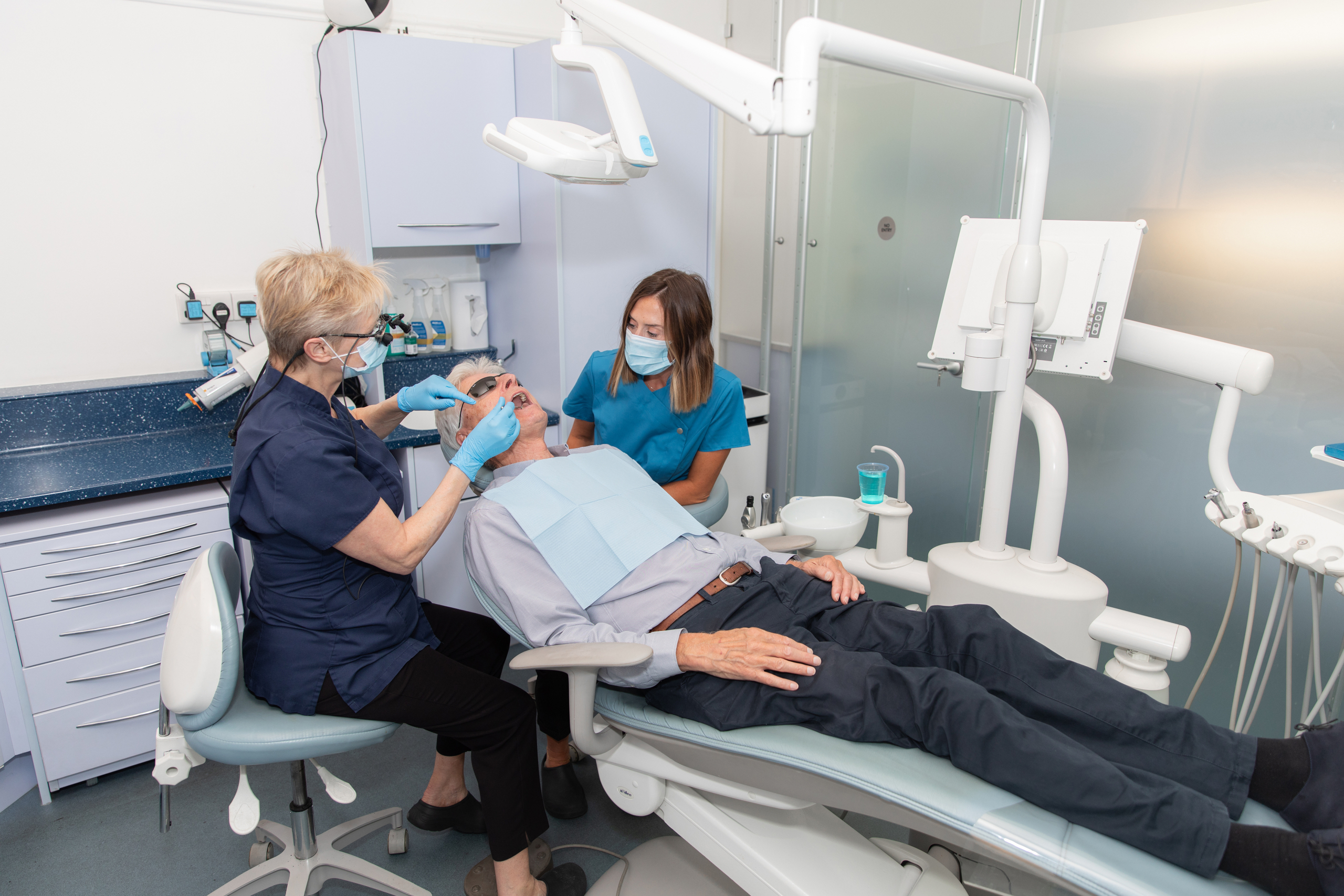 Jo and Lucy working with a patient