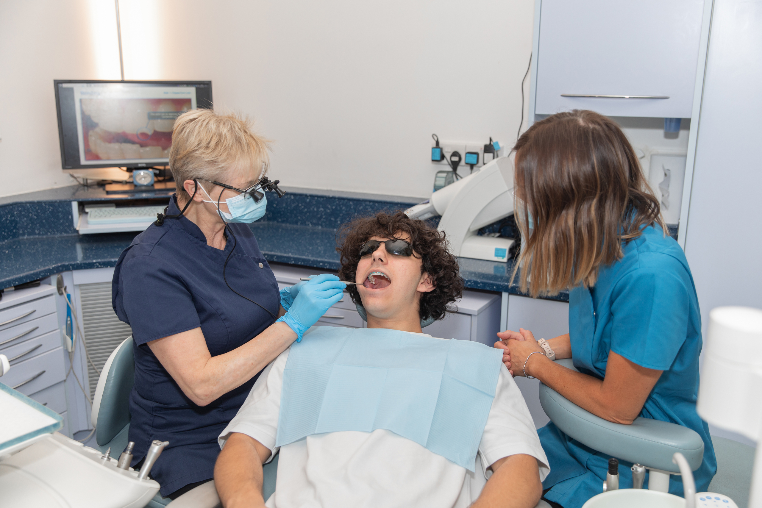 Jo and Lucy working with a patient